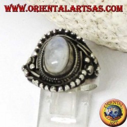 Silver ring with oval rainbow moonstone with asymmetrical ball decorations