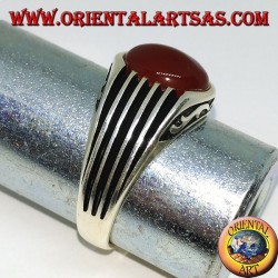 Silver ring with an oval cabochon carnelian and staves on the sides