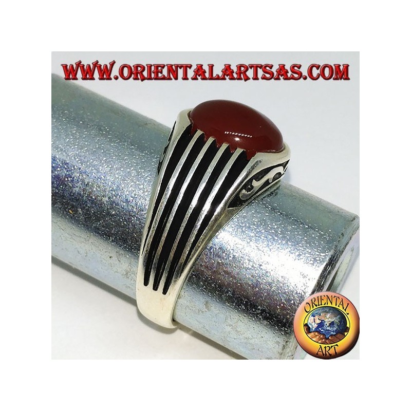 Silver ring with an oval cabochon carnelian and staves on the sides