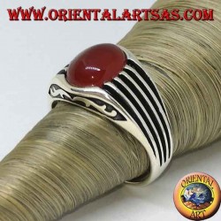 Silver ring with an oval cabochon carnelian and staves on the sides