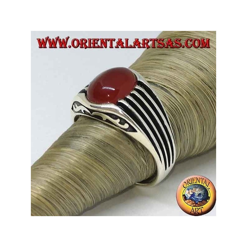 Silver ring with an oval cabochon carnelian and staves on the sides