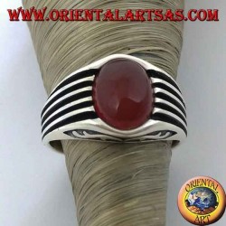 Silver ring with an oval cabochon carnelian and staves on the sides