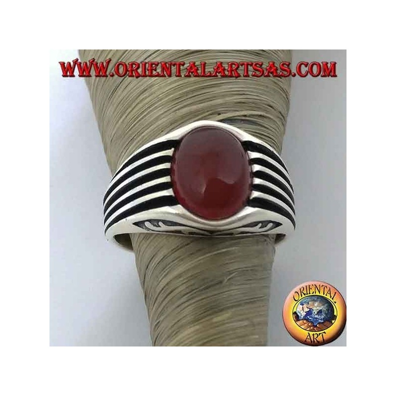 Silver ring with an oval cabochon carnelian and staves on the sides
