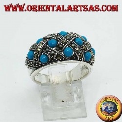 Anillo de plata con banda curva con diez turquesas esféricas rematadas con marcasita