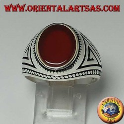 Silver ring with flat oval carnelian with braid at the edges of the ring
