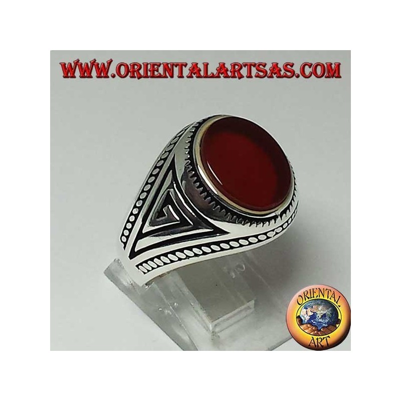 Silver ring with flat oval carnelian with braid at the edges of the ring