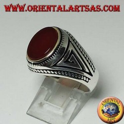 Silver ring with flat oval carnelian with braid at the edges of the ring
