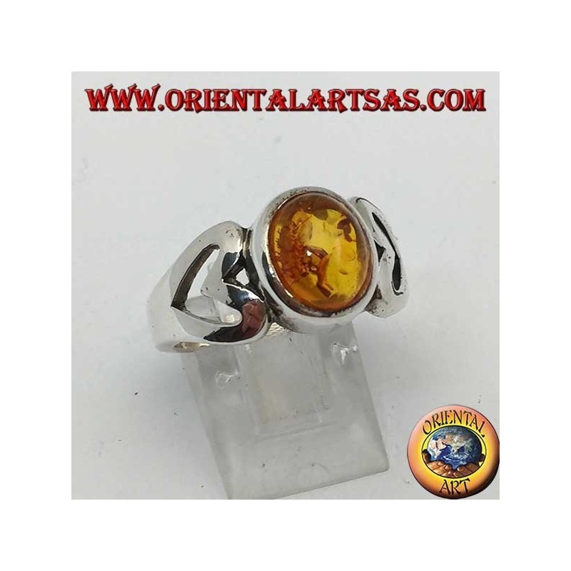 Silver ring with oval amber and openwork heart on the sides