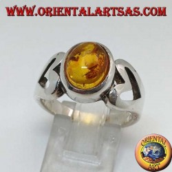 Silver ring with oval amber and openwork heart on the sides