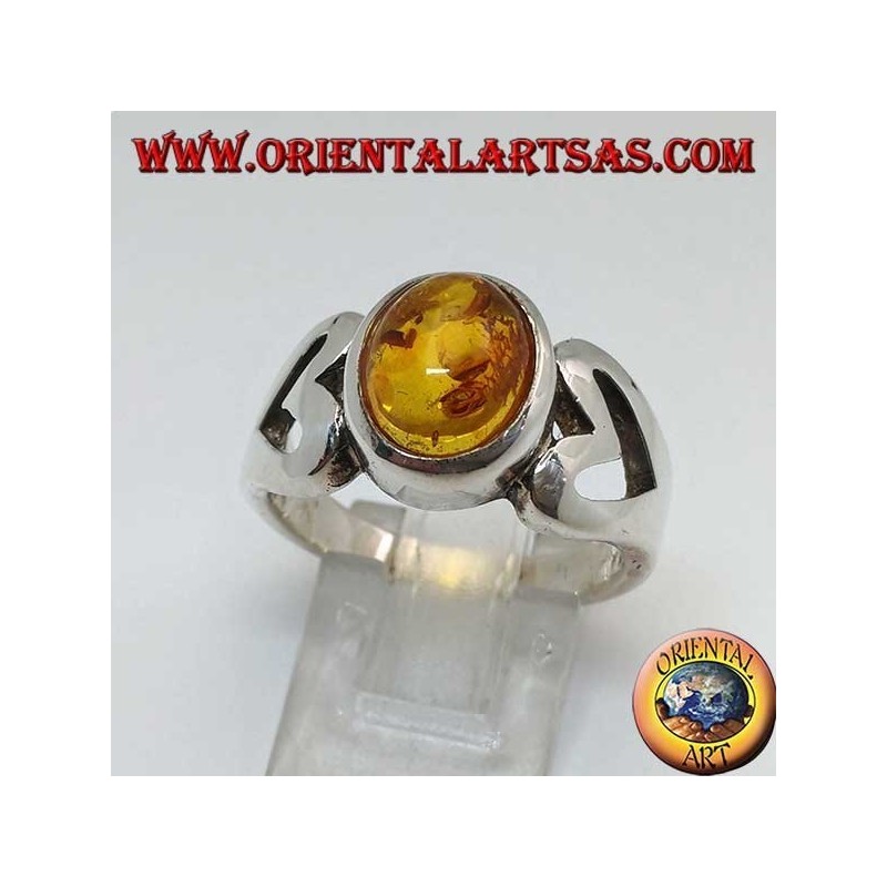 Silver ring with oval amber and openwork heart on the sides
