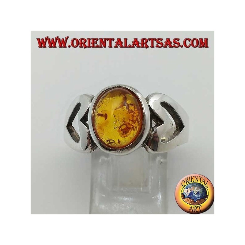 Silver ring with oval amber and openwork heart on the sides