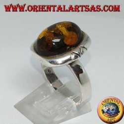 Silver ring with oval green amber and large engraved border