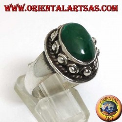Silver ring with studs around the body, of the oval natural antique Turquoise
