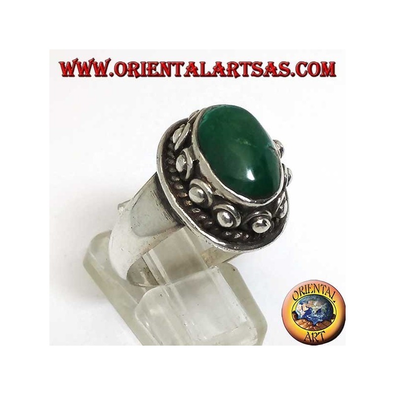 Silver ring with studs around the body, of the oval natural antique Turquoise