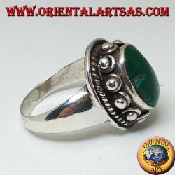Silver ring with studs around the body, of the oval natural antique Turquoise