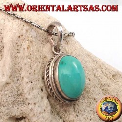 Silver pendant with oval natural turquoise and braided border
