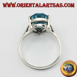 Silver ring with drop-shaped blue topaz with claw setting