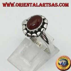 Silver ring with oval cabochon carnelian surrounded by studs