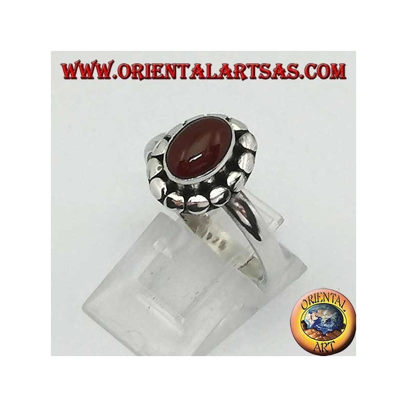 Silver ring with oval cabochon carnelian surrounded by studs