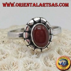 Silver ring with oval cabochon carnelian surrounded by studs