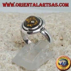Silver ring with green round amber embraced by discs
