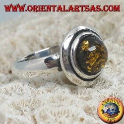 Silver ring with green round amber embraced by discs