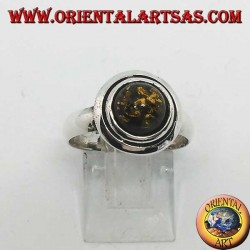 Bague en argent avec ambre rond vert entouré de disques