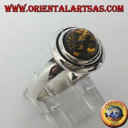 Anillo de plata con ámbar redondo verde abrazado por discos