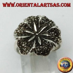 Silver ring in the shape of a lily flower, a symbol of purity