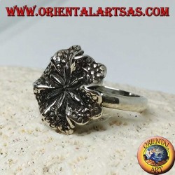 Silver ring in the shape of a lily flower, a symbol of purity