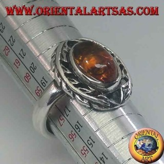 Silver ring with oval amber surrounded by bay leaves