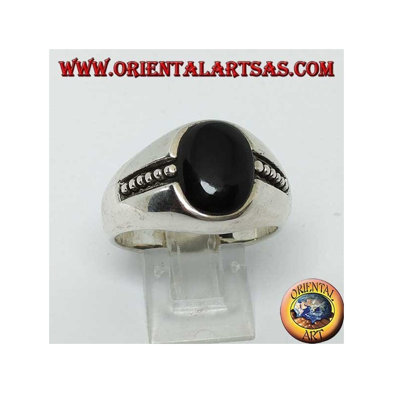silver ring with oval onyx and bas-relief dots on the sides