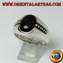 silver ring with oval onyx and bas-relief dots on the sides