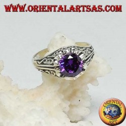 Inlaid silver ring with amethyst-colored zircon set