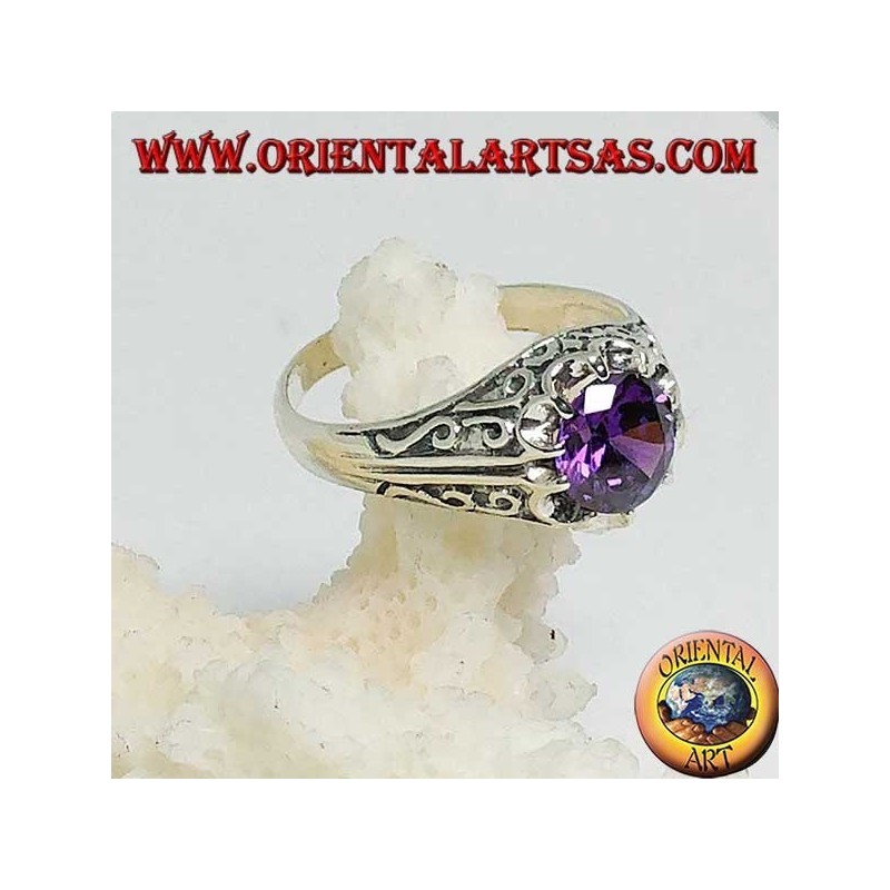 Inlaid silver ring with amethyst-colored zircon set