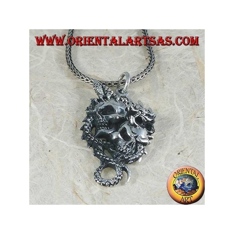 Silver dragon pendant with two skulls