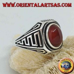 Silver ring with oval cabochon carnelian and waves in bas-relief on the sides