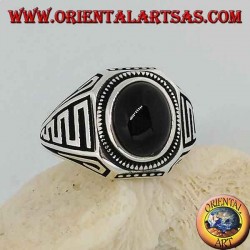 Silver ring with oval cabochon onyx and waves in bas-relief on the sides