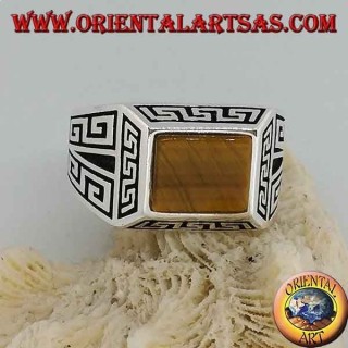 Silver ring with rectangular tiger's eye, surrounded by bas-relief Greek frets