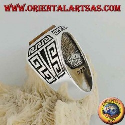 Silver ring with rectangular tiger's eye, surrounded by bas-relief Greek frets