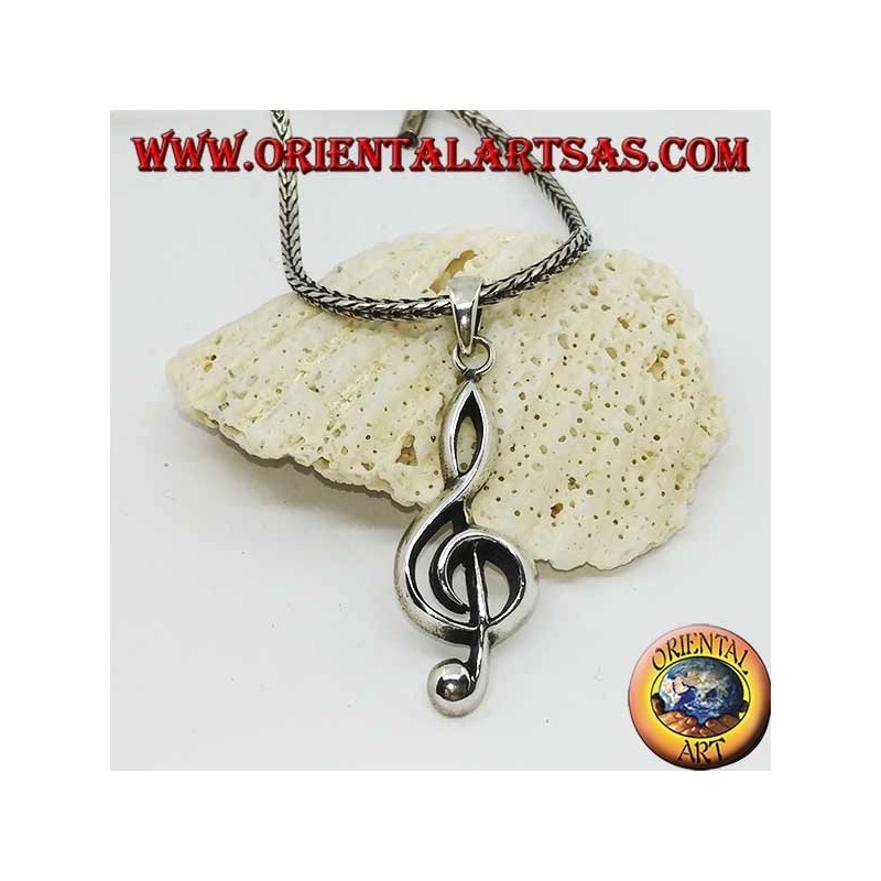 silver pendant treble clef or key of a large sun
