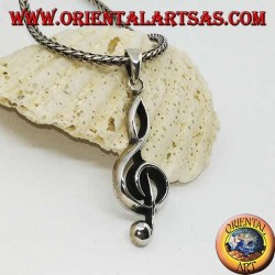 silver pendant treble clef or key of a large sun