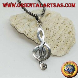 silver pendant treble clef or key of a large sun