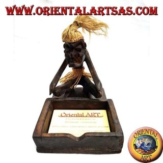 Business card holder with sculpture of a primitive man in teak wood