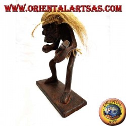 Sculpture of a primitive man guitarist in teak wood