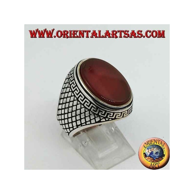 Silver ring with large flat oval carnelian surrounded by a Greek relief