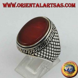 Silver ring with large flat oval carnelian surrounded by a Greek relief