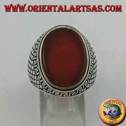 Silver ring with large flat oval carnelian surrounded by a Greek relief