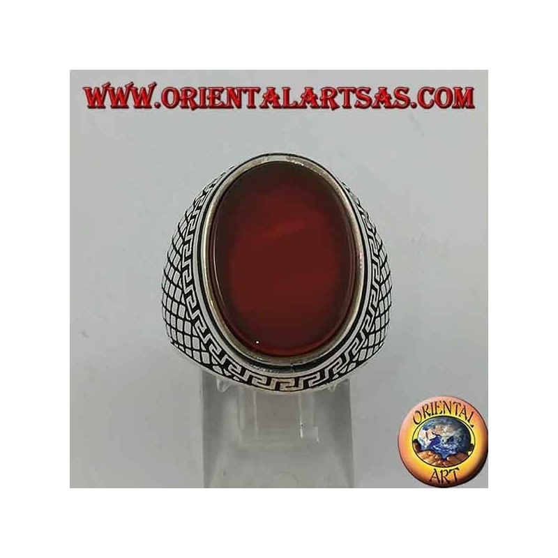 Silver ring with large flat oval carnelian surrounded by a Greek relief