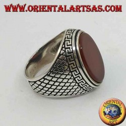 Silver ring with large flat oval carnelian surrounded by a Greek relief